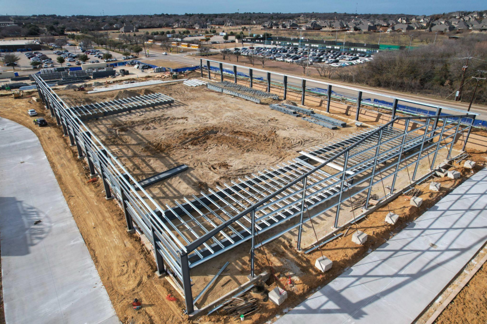 External view of construction frame of Keller HS Indoor Extracurricular Program Facility.