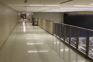 New second floor hallway overlooking the renovated  Cafeteria space. 