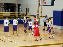 KISD special olympics basketball players complete in a tournament 