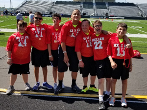 Flag football athletes pose for a photo at a tournament